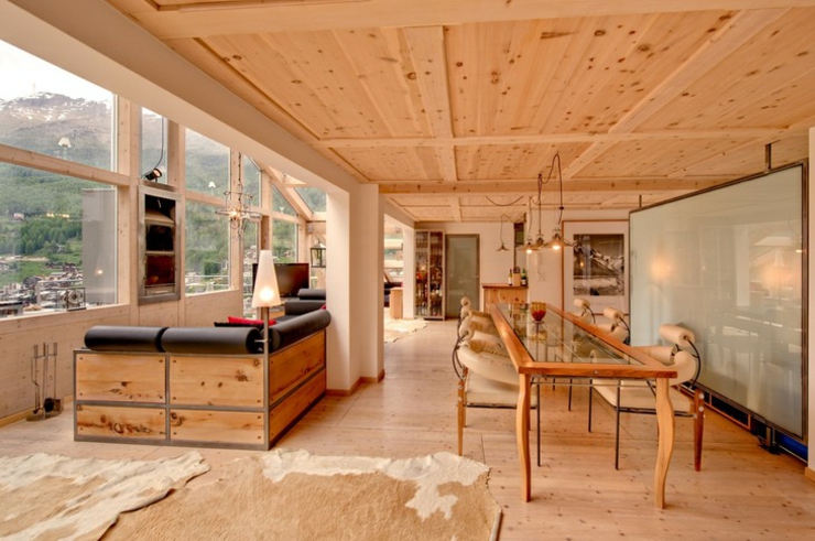 El salón del Penthouse en Zermatt Suiza con áreas separadas sala penthouse heinz julen zermatt suiza