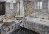 Un baño de hotel moderno y antiguo alavés